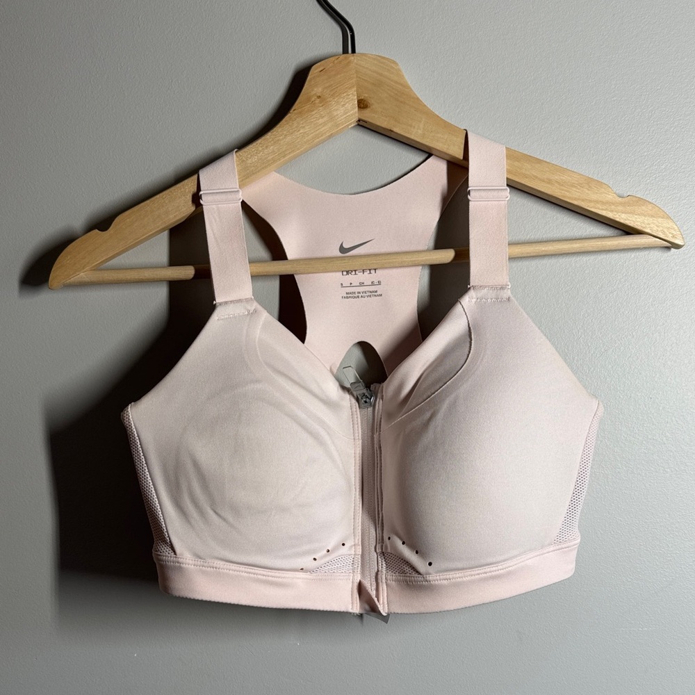 Nike Women's light, nude Zip-Front Sports Bra